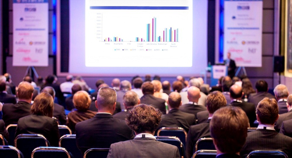 Delegates watching a business presentation during a conference